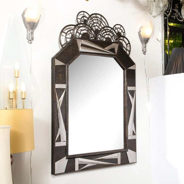 This Art Deco Wrought Iron Mirror with Highly Stylized Cubist Detailing and stylized geometric Floral Elements originates...