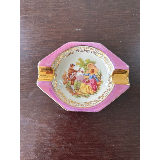 Vintage limoges with crown mark pink and gold decorated gentleman is playing guitar and the lady is sitting a chair with...