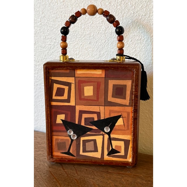 One of a kind wooden cigar box purse. The front and back images are from artist Celeste Peters “Groovy Martini II”...