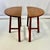 This pair of Swedish Folk Art Teak Side Tables are gorgeous in their simplicity. The half round table tops are supported...