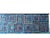 Ottavio Missoni's tapestry features his signature design. It features repeating squares in shades of blue. The textures...