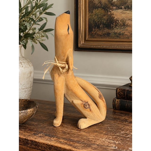 A wonderfully expressive hand-carved wooden coyote by New Mexico folk artist Max Alvarez. The seated coyote is rendered in...