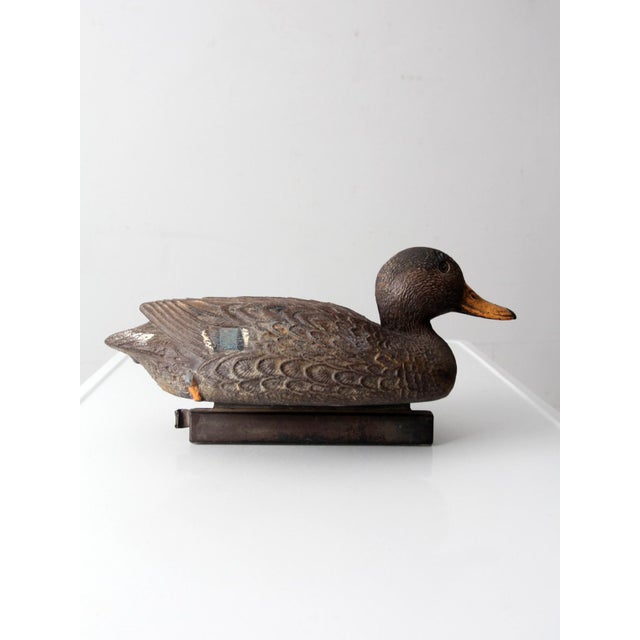 This vintage Flambeau mallard duck decoy dates to the late 20th century and features molded feather detailing, classic...