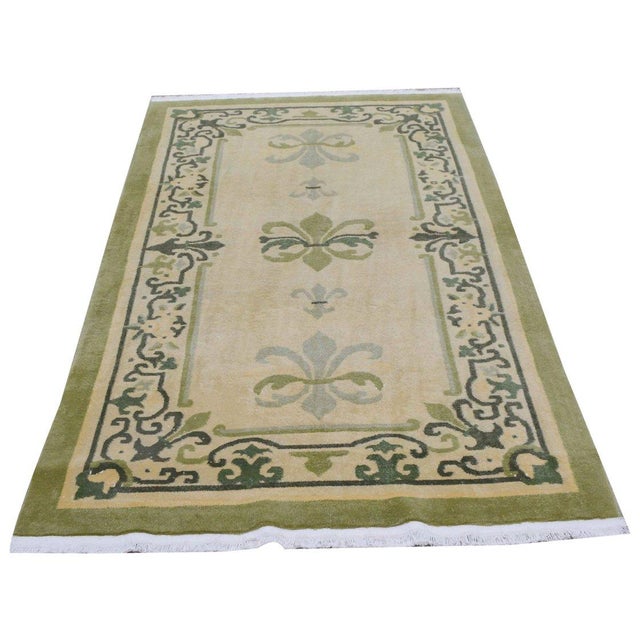 Hand-knotted with care using traditional rug-making techniques, this wool rug blends timeless craftsmanship with a modern...