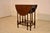Circa 1900 English Oak side table with gate-legs. The top of the table has nice graining and a beveled edge. It measures...