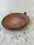 Rustic terra cotta bowl with handle. Made in Mexico. A simple display of Mexican pottery. Made in Mexico