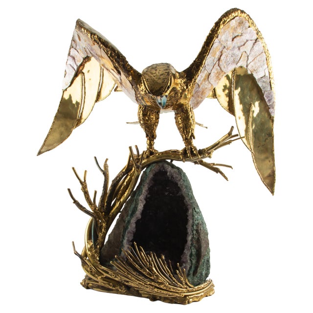A dramatic sculptural lamp depicting an eagle captured at the exact moment of descent, its wings fully unfurled and arched...