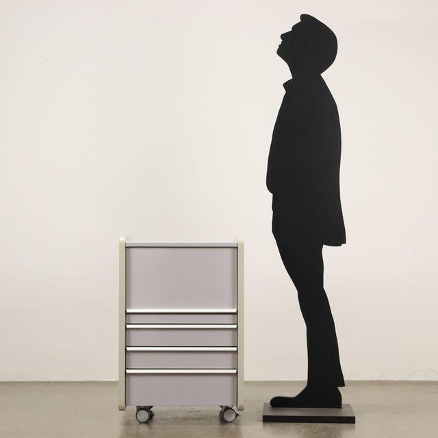 Cabinet with vertical opening compartment, sliding drawers and wheels, ennobled wood. The handles are with aluminum...