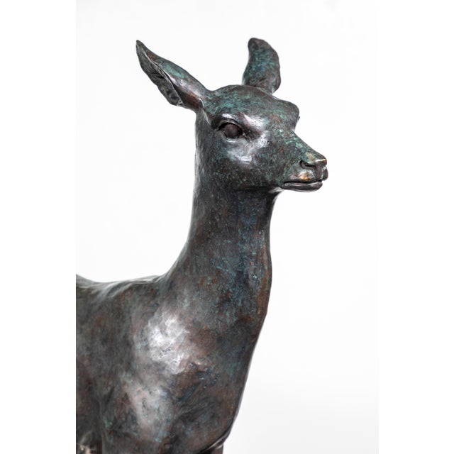 Substantial, sensitively molded, graceful circa 1940, hand-cast, bronze sculpture of a doe.