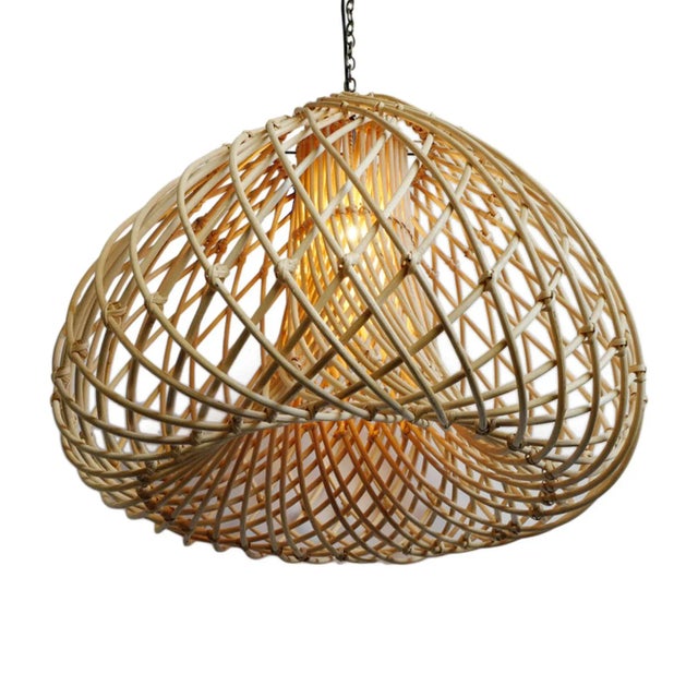 Beautiful thick rattan Java Drop hanging lantern. Attractive swirling design produces a natural glow when illuminated....