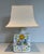 This beautiful ceramic table lamp features bird and flower motifs. It is a French piece. Circa 1970