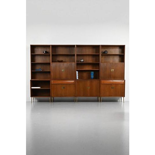 Italian modular cabinet, designer unknown but with a beautiful finish all over. This cabinet has 8 parts; 4 cabinets below...