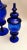 Delicious and harmonious pair of blue blown glass bottles with lid; the two bottles were made in a magical, fascinating...