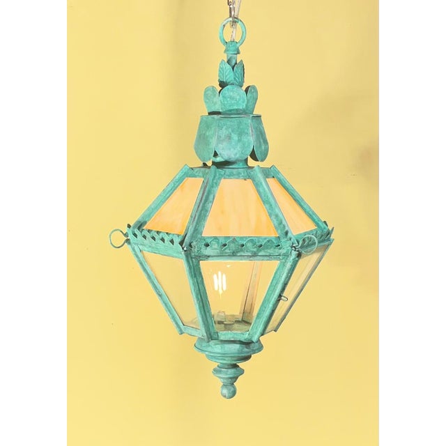 Elevate your space with this exquisite vintage-inspired hanging lantern. Featuring a striking hexagonal silhouette and a...