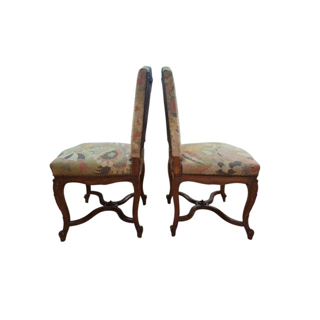 This exquisite pair of antique French side chairs is executed in the majestic Louis XIV Style, blending grand Baroque...