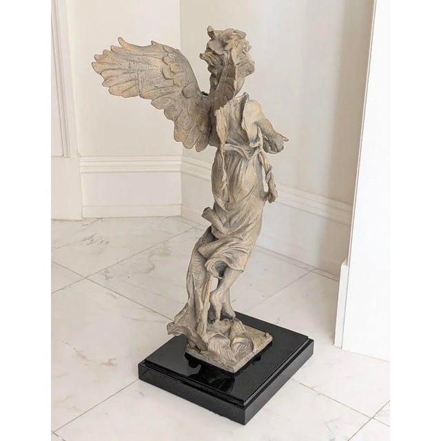 The work of art was created in 1999 and measures 30" in height including the beveled black granite base which measures 11"...