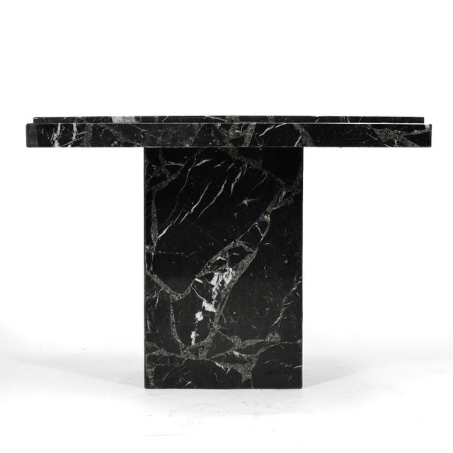 An elegant, minimalist form, this side table by Ello is crafted of black composite marble. Unmarked. Also available is the...