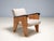 A rare mid-century lounge set consisting of three a-frame wooden armchairs and one matching coffee table, produced in...
