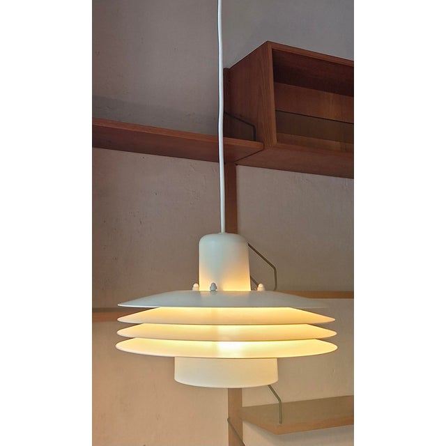 Horn Belysning stylish pendant lamp with stepped design emitting soft diffused light, Denmark 1980s. Maximum height of...