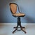 This swivel chair is listed in the Thonet catalogue of 1886 as "Drehstockerl mit Rücklehne", in English as "Music chair,...