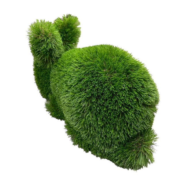 Bring a touch of whimsical, maintenance-free greenery to your space with this charming faux grass topiary bunny. Crafted...