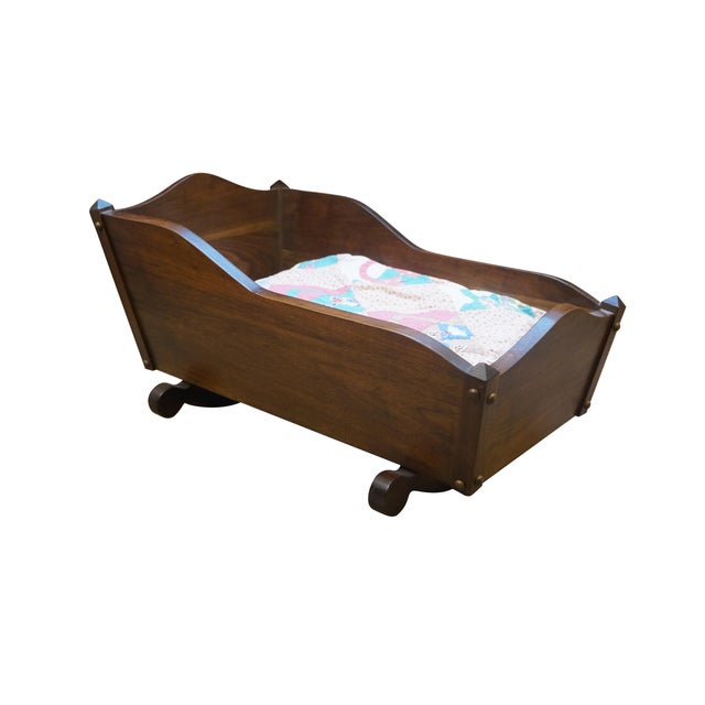 Vintage 20th century wooden doll sized cradle with oxbow head and foot boards. Includes modern pillow form as cushion and...