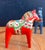 A Dala horse (Swedish: Dalahäst) is a traditional wooden figurine depicting a horse, originating from the Swedish province...