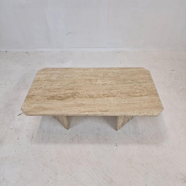 Very elegant Italian coffee table handcrafted out of travertine. The beautiful rectangle shaped top is rounded on the...