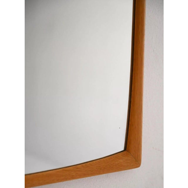 Beautiful wall mirror with a solid blond oak frame. The mirror is in excellent condition, completely original with no...