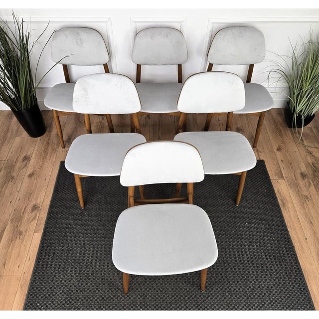 Beautiful and stylish Italian Mid-Century Modern set of 6 dining chairs, with greatly worked and shaped wooden structure...