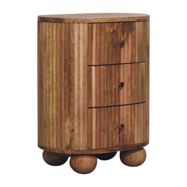 This three-drawer bedside table combines clean lines with playful detail. Crafted from solid mango wood in a warm oak...