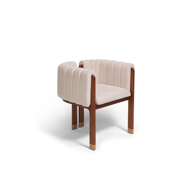 The Maya Dining Chair epitomizes refined luxury through its quilted upholstery and timeless, enveloping silhouette....