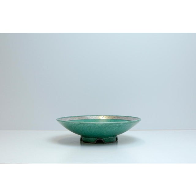 A Wilhelm Kåge Argenta bowl produced by Gustavsberg, Sweden, in 1935. Finished in the iconic turquoise-green glaze with...