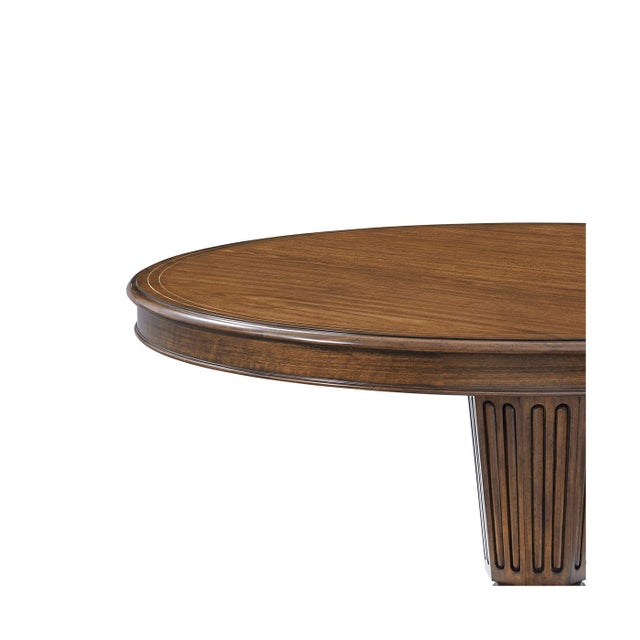 Masterfully crafted with figured walnut with a rich warm heirloom finish. The expansive round top sits on a sculptural...