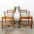 Pair of solid oak armchairs with teak armrests. Recently re-upholstered in a gray wool with green stripes. There is a...