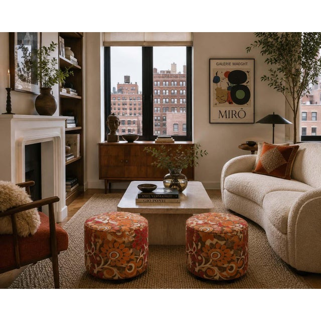 A playful and highly decorative vintage Moroccan round pouf or ottoman, upholstered in a bold 1970s-style psychedelic...