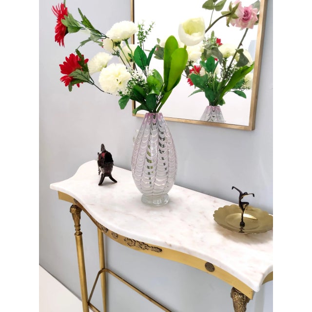 Made in Italy, 1940s. This is a lilac and transparent Murano glass vase. It is a vintage item, therefore it might show...