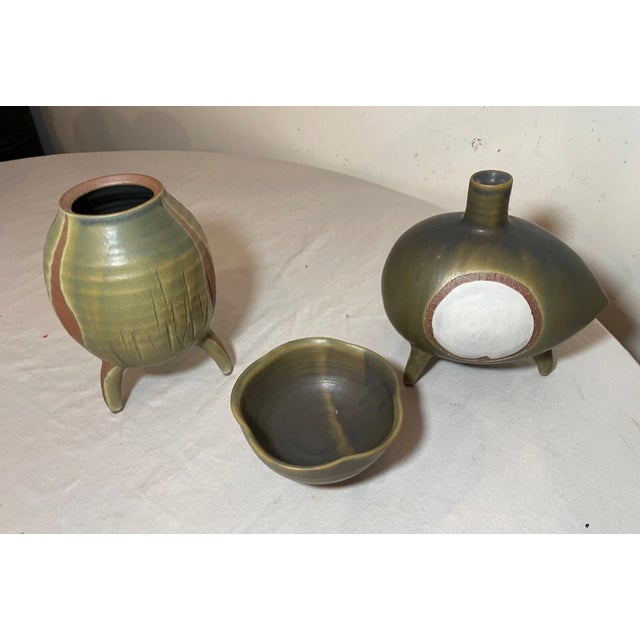 This antique Japanese pottery lot is a beautiful addition to any collection. This set is handmade with a lovely green...