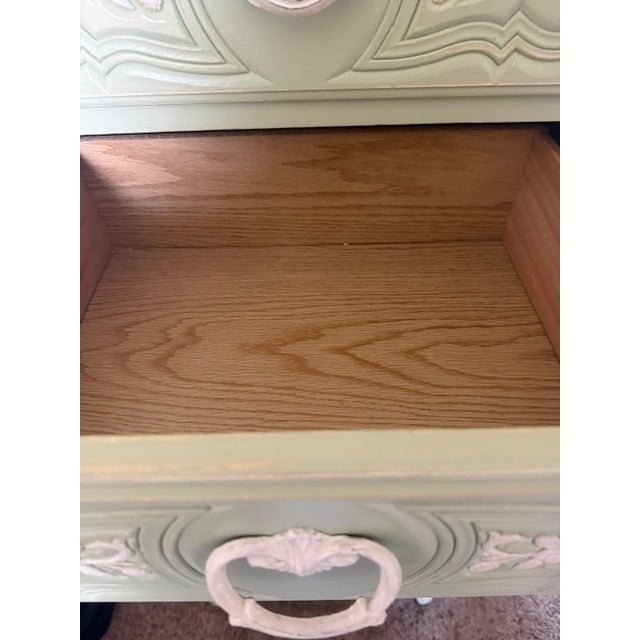 This is a beautiful vintage-style bedroom furniture set in a soft, distressed sage green/antique mint finish with ornate...