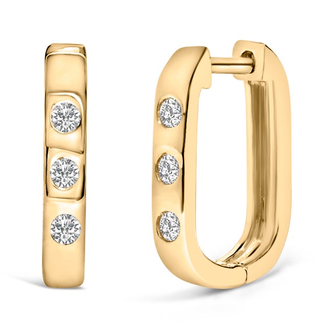 Crafted with precision, these resplendent huggie hoop earrings exude elegance and sustainability, epitomizing modern...