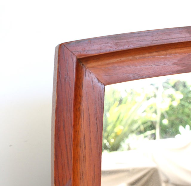 1960's MCM Broyhill Brasilia wall mirror, made of genuine walnut frame. We love the elegantly classic mid-century modern...