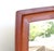 1960's MCM Broyhill Brasilia wall mirror, made of genuine walnut frame. We love the elegantly classic mid-century modern...