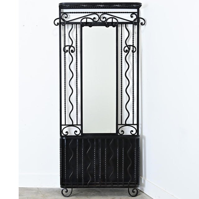 A multipurpose French hall tree from circa 1930 that will serve many functions in an entryway, hall, or other active room...