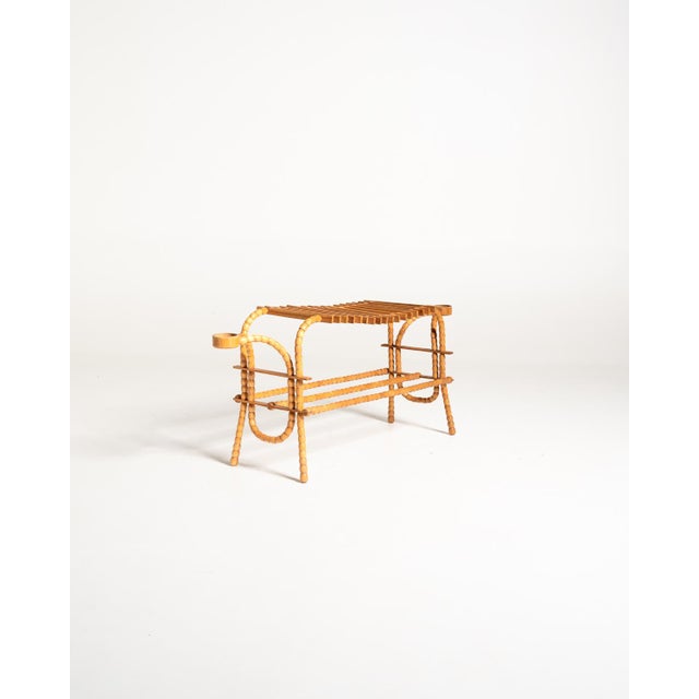 Birch and elm planter with a curved structure, featuring turned spherical elements, a slatted surface, and circular...