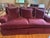 Bring timeless elegance into your home with this beautiful pair of oversized sofas upholstered in a rich red velvet....