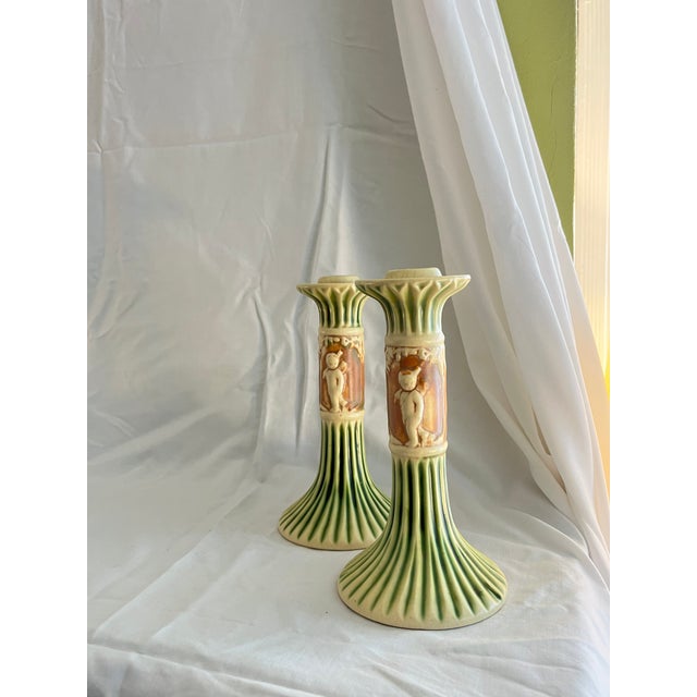 A darling pair of antique Roseville Donatello candlesticks. Set the table for your Summer Soirée! Add to your collection...