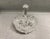 A vintage cut crystal lidded candy dish from the late 20th century. The footed covered dish features ornate pinwheel...