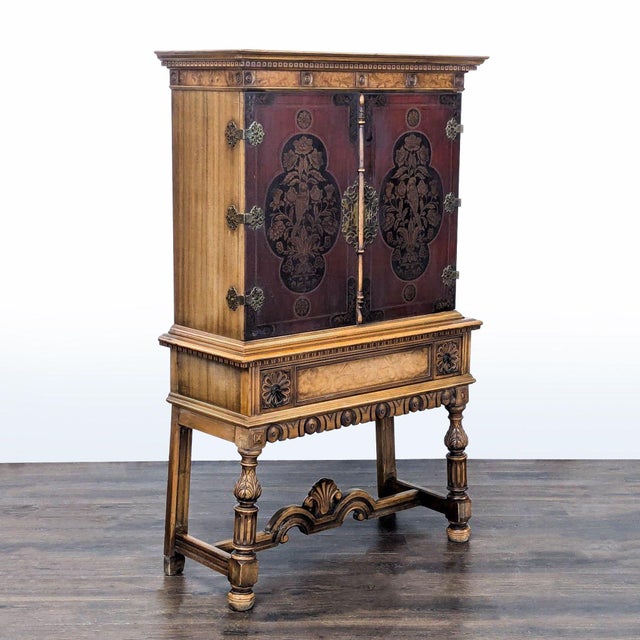Early 20th century cabinet with interior shelving and drawer. Hand painted doors depicting flowers and birds and burled...