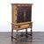 Early 20th century cabinet with interior shelving and drawer. Hand painted doors depicting flowers and birds and burled...