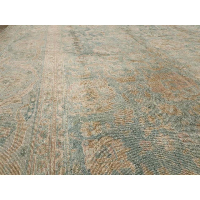 Watery blue oversize antique indian rug from the early stages of the 20th century